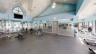 Imagine waking up every day to your very own fitness sanctuary. This exceptional 1,070 square foot space in Gainesville, FL, is not just a gym – it's a gateway to your best self. The thoughtfully designed layout maximizes every inch, creating distinct zones for cardio, strength training, and functional fitness.

As you step inside, you're greeted by soaring ceilings that create an atmosphere of openness and motivation. The calming blue walls and abundant natural light from large windows inspire a sense of serenity, making your workouts both invigorating and rejuvenating.

State-of-the-art equipment lines the space, from treadmills and ellipticals to an impressive array of weight machines and free weights. The mirrored walls not only make the space feel larger but also allow you to perfect your form as you exercise.

This fitness oasis isn't just about physical health – it's about cultivating a lifestyle of wellness and achievement. With this gym at your fingertips, you'll have the tools and inspiration to reach your fitness goals, reduce stress, and enhance your overall quality of life.

Invest in yourself and your future. This isn't just a property – it's an opportunity to transform your daily routine and prioritize your health and happiness. Welcome to your new motivation station, where every day is a step towards a better you.