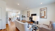 Located at 901 E Lincoln Hwy in Exton, PA, this two-story, 3-bedroom, 3-bathroom home offers a thoughtfully designed layout across two well-proportioned floors. The main level opens into a bright, open-concept living and kitchen area, where rich hardwood flooring flows throughout. The living room features recessed lighting, large windows that invite natural light, and a comfortable, welcoming ambiance. The kitchen is outfitted with crisp white shaker cabinets, white quartz countertops, a subway tile backsplash, stainless steel appliances, and light hardwood floors — a clean, modern aesthetic ideal for everyday living and entertaining. A separate dining area with hardwood flooring provides an intimate space for meals. Upstairs, the primary bedroom offers plush carpeting, generous natural light through large windows, and access to a dedicated closet with built-in wire shelving. The additional bedrooms are equally well-lit and comfortable, each with soft carpeting and clean finishes. The bathrooms are finished with neutral tile, including a walk-in glass-enclosed shower with subway tile detailing. A hallway and closet complete the upper level, adding to the home's functional storage and flow.