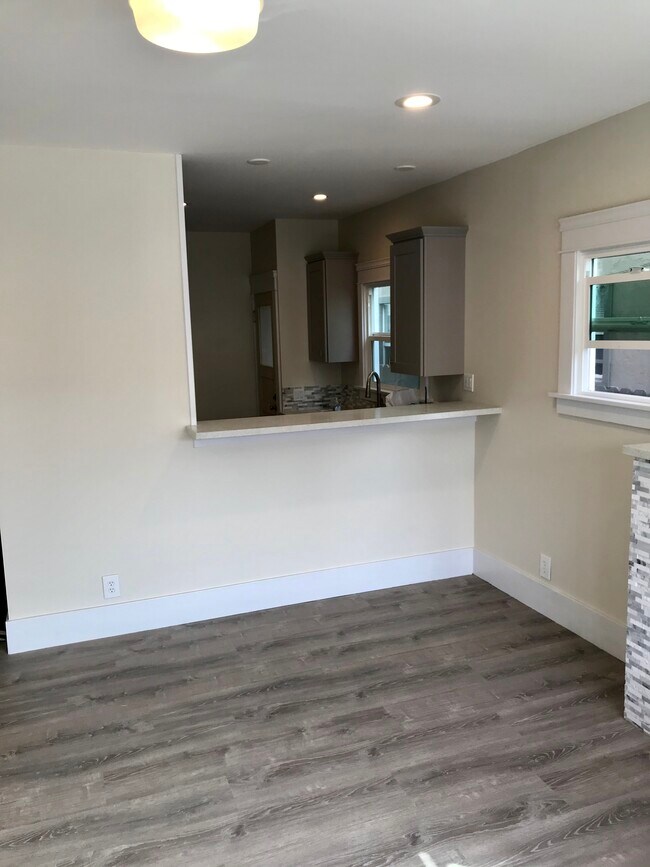Main living area pass-through bar seating into kitchen - 3031 E 7th St