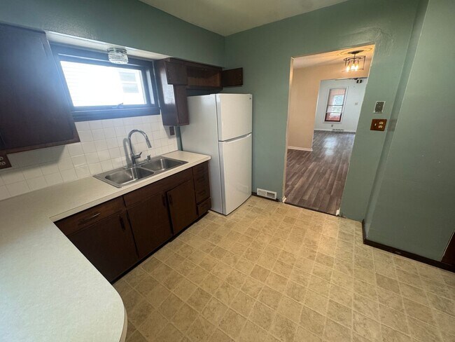Building Photo - Character-Filled Akron Home with a Flexible Multi-Room Layout