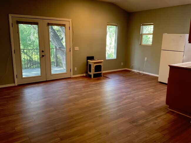 Private entrance, skylight windows, deck overlooks natural creek & oak trees. Park in garage - 85 Sherwood Dr