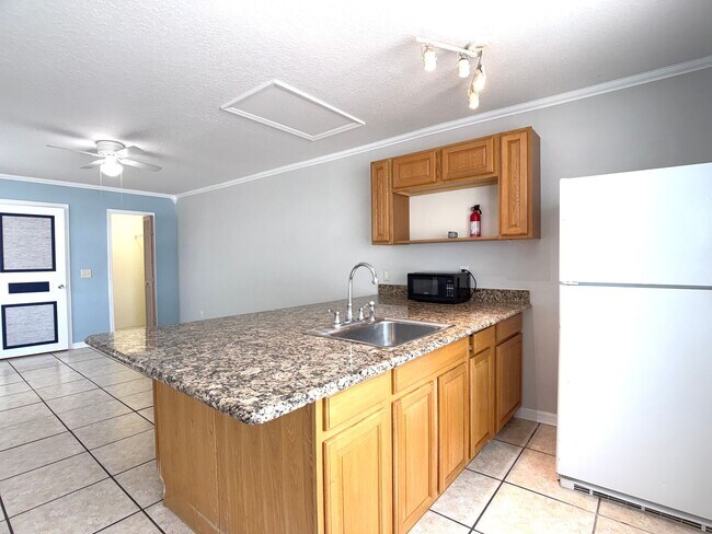 Building Photo - Move-in ready Efficiency in the Coveted Area of Four Corners Area—Water and Electric Included (wi...