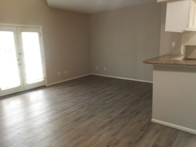 Living Area with Door to Covered Patio - 7575 Cambridge St