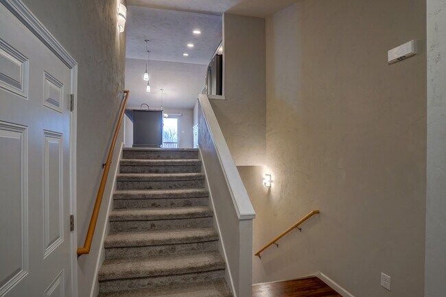 Stairs up to upper living area - 810 Thompson Dr