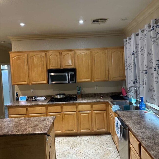 Building Photo - Spacious 4-Bedroom Retreat with Poolside O...