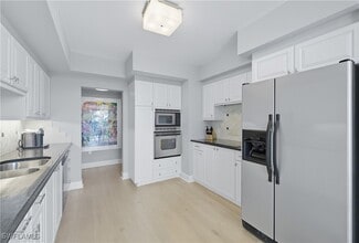 Building Photo - 7515 Pelican Bay Blvd