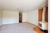 Located at 2802 Yulupa Ave in Santa Rosa, CA, this two-story, 2-bedroom, 3-bathroom home is thoughtfully laid out across two well-proportioned floors. The main level hosts a bright living room anchored by a distinctive terra-cotta tiled corner fireplace and sliding glass doors that open to an outdoor patio, filling the space with natural light. Adjacent, the kitchen features a wraparound tile-topped peninsula with a coil cooktop, warm wood cabinetry, a tile backsplash, and an overhead range hood — opening directly into the dining area with hardwood-style flooring and a ceiling light fixture. Upstairs, the spacious primary bedroom offers mirrored sliding closet doors, plush carpet, and a private sliding glass door leading to a balcony with outdoor views. The primary bathroom includes a dual-sink vanity with oak cabinetry and mosaic tile accents, leading to a separate tub-shower combo enclosed with sliding glass doors. The second bedroom is comfortably sized with a reach-in closet. Additional highlights include multiple closets for abundant storage, a utility room, and two staircases for convenient circulation. The home's consistent warm wood tones, tile details, and practical layout create a functional and cohesive living environment.