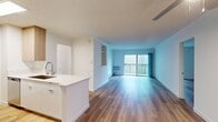 This contemporary 2-bedroom, 1-bathroom apartment in Newport Beach offers 1,170 square feet of well-designed living space. The open floor plan seamlessly integrates the kitchen, living, and dining areas, creating a spacious and airy atmosphere. The kitchen is equipped with modern appliances, sleek cabinetry, and a convenient island, perfect for meal preparation and casual dining.

Both bedrooms are generously sized, with the primary bedroom boasting 240 square feet of space. Large windows in the living areas and bedrooms flood the apartment with natural light, while providing views of the surrounding area. The bathroom features a modern design with a shower/tub combination.

A standout feature of this apartment is the presence of two balconies, offering outdoor spaces to enjoy the Newport Beach climate. The entire space is finished with durable, attractive wood-look flooring, adding warmth and easy maintenance to the home.

Additional amenities include a closet for storage and an in-unit air conditioning system for year-round comfort. The neutral color palette throughout the apartment provides a blank canvas for personalization, making it easy for residents to create their ideal living environment in this desirable Newport Beach location.