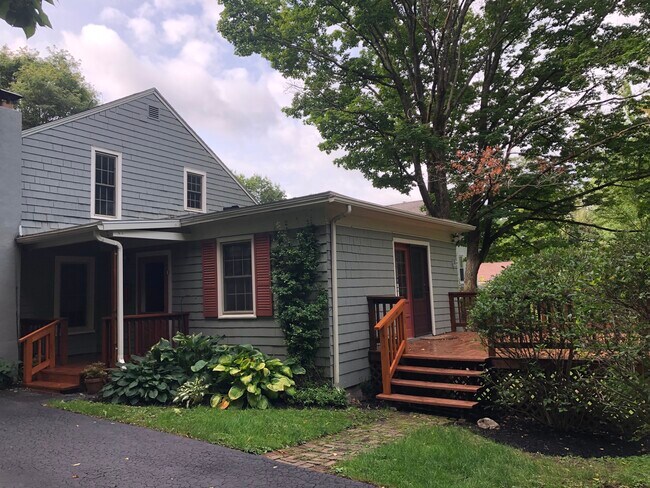 With side porch and back deck overlooking private yard and gardens. - 11 Kellogg St