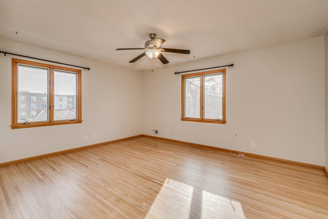 Bedroom 1. Newly finished floors and lots of natural light. - 5707 Goodrich Ave