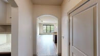 This contemporary 750 square foot apartment in Baltimore offers a blend of style and functionality. The single-bedroom layout, spanning one floor, is complemented by two full bathrooms, providing both convenience and privacy. The primary bedroom, at 140 square feet, is generously sized and features plush carpeting and a ceiling fan for comfort.

The kitchen is a standout feature, boasting rich wood cabinetry, sleek stainless steel appliances, and elegant granite countertops. A built-in wine rack adds a touch of sophistication. The open-concept design seamlessly connects the kitchen to the living area, which is illuminated by large windows offering city views.

Throughout the apartment, you'll find a mix of flooring materials that add character and practicality. The living areas showcase handsome wood-look flooring, while the bedroom retains cozy carpeting. The bathrooms feature durable and attractive slate tiling.

Architectural elements like arched doorways and recessed areas add visual interest and a sense of flow to the space. The apartment's neutral color palette provides a versatile backdrop for any decor style. With its thoughtful design and high-end finishes, this apartment offers a comfortable and stylish urban living experience in the heart of Baltimore.