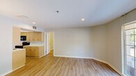 Located at 1855 Craigshire Rd in Maryland Heights, MO, this 2-bedroom, 3-bathroom residence offers a well-organized single-floor layout designed for comfortable everyday living. Light wood-tone flooring flows consistently throughout the main living areas and bedrooms, lending the space a warm, cohesive feel. The open living room is bright and inviting, highlighted by recessed lighting and a large window that draws in natural light and outdoor views. The galley-style kitchen is efficiently designed, featuring light wood cabinetry, white countertops, and a full suite of black appliances including a refrigerator, range, built-in microwave, and dishwasher. The primary bedroom is a comfortable retreat with wall-mounted sconce lighting, and the second bedroom also includes natural light from a window and matching sconce fixtures. The bathrooms are clean and functional — one features a wood-toned vanity with a wide mirror, bright vanity lighting, and light tile flooring, while another includes a full tub/shower combination. A dedicated closet provides additional storage. Neutral gray-toned walls throughout keep the overall ambiance calm and move-in ready.