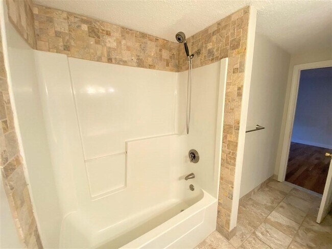 tiled walls and flooring in bathroom - 35 Prospect St