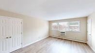 Located at 350 Baldwin Road in Parsippany-Troy Hills, NJ, this single-floor, 2-bedroom, 1-bathroom residence offers a clean, modern aesthetic with thoughtful updates throughout. Light-toned hardwood flooring runs consistently across the living spaces, lending the home a bright and cohesive feel.

The living room is a comfortable, open area bathed in natural light from a wide multi-pane window, complemented by a wall-mounted air conditioning unit and baseboard heating. The kitchen has been fully renovated and features white shaker-style cabinetry, granite countertops, a subway tile backsplash, stainless steel appliances including a range, microwave, dishwasher, and refrigerator, and recessed lighting above.

The primary bedroom is generously sized with dual closets offering ample storage, while the second bedroom provides its own window and baseboard heating. Both bedrooms are finished in warm neutral tones with the same hardwood flooring. The bathroom is well-appointed with classic white subway tile, a mosaic accent border, a tub-shower combination, and a window for natural ventilation. A connecting hallway ties the layout together efficiently, creating a functional and comfortable living environment.