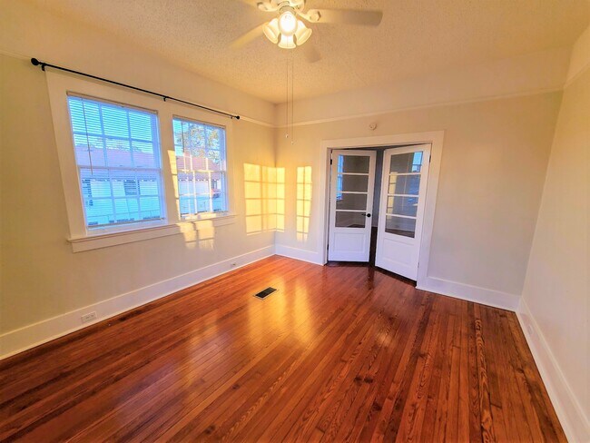 Living Room w/ French Doors to Additional Living/Dining/3rd Bedroom Space - 1316 Monroe St