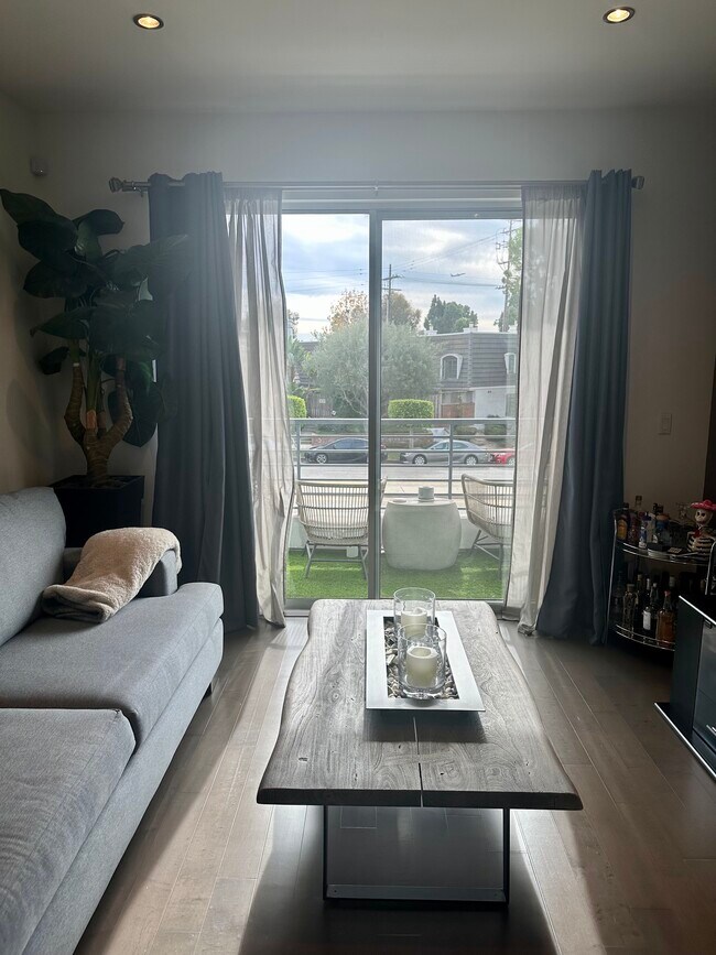 Living Room with Balcony - 7857 W Manchester Ave
