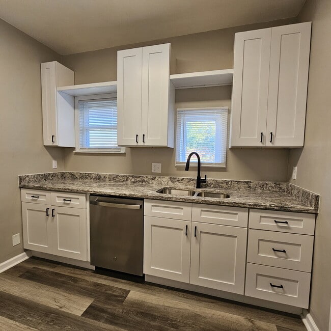 Building Photo - Duplex - 2 Bedroom Completely Remodeled Living Space with New Laminate Flooring on Main Floor alo...