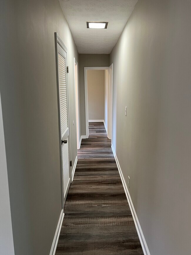 Hallway leading to laundry room (right) and bedrooms/bath - 2534 Rockefeller Rd
