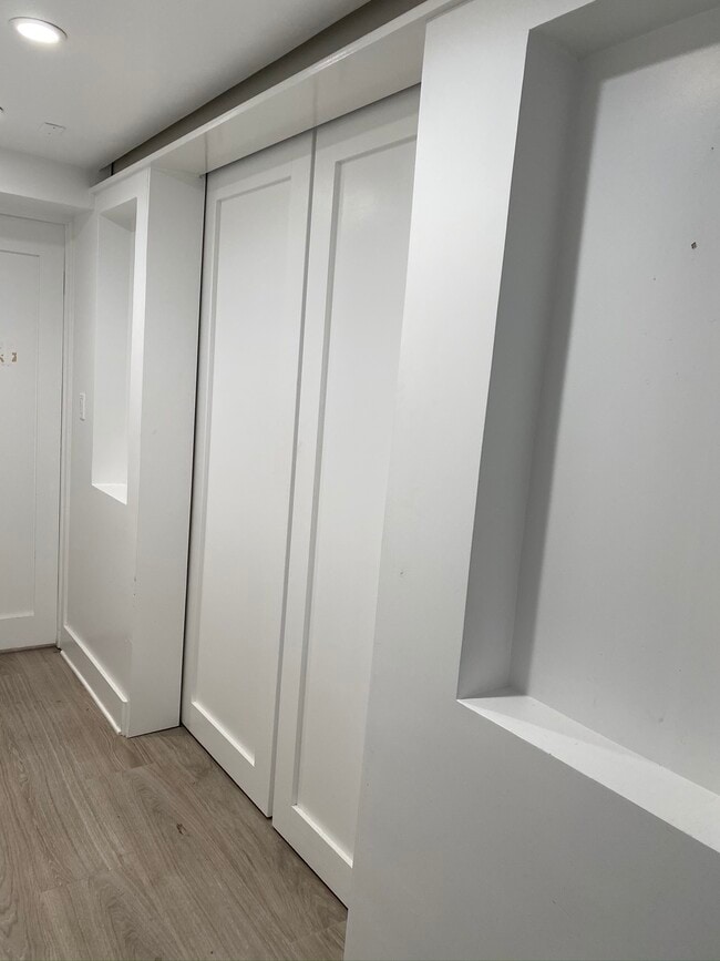 Hallway with den sliding pocket doors closed - 2915 28th St NW
