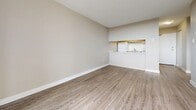 Located at 190 Cherryhill Cir in London, Ontario, this one-bedroom, one-bathroom unit offers a practical and well-appointed layout across a single floor. Light-toned laminate hardwood flooring runs throughout the space, lending a clean, cohesive look to every room.

The living room is open and airy, featuring a large sliding glass door that connects directly to a private balcony, inviting generous natural light and outdoor views of the surrounding area. The open-concept design flows seamlessly into the kitchen, which is accessible via a pass-through counter, keeping the layout functional and connected.

The bedroom is a comfortable, well-proportioned room featuring a large window with baseboard heating beneath it, providing both natural light and warmth. Neutral beige walls complement the light flooring throughout.

The bathroom is clean and efficiently designed, featuring a full soaker tub with a subway tile surround, chrome fixtures, and overhead cabinetry for added storage.

Baseboard heating is present throughout the unit, ensuring year-round comfort. The neutral color palette of warm beige and soft grey tones creates a calm, versatile atmosphere suitable for a range of interior styles. This unit is an excellent option for those seeking a straightforward, well-maintained living space in London's west end.