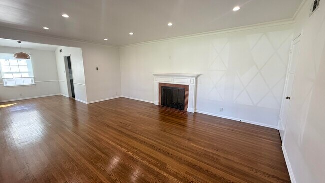 Living room with recessed lighting. Wired for TV over fireplace - 4715 Allott Ave