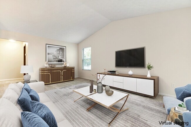 Large living area with vaulted ceilings. - 7736 Thorncroft Ct