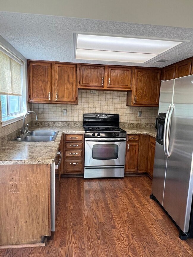 Building Photo - Corner Lot with Large Deck and Cozy Backyard
