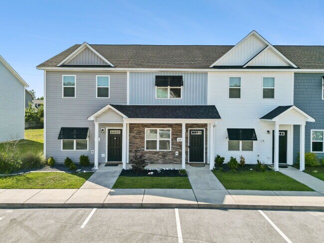 Building Photo - Available Now! Enjoy low-maintenance coastal living in this beautiful 2-bedroom, 2.5-bath townhom...