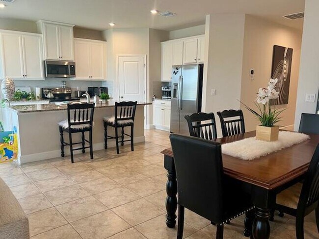 Foto del edificio - Open concept home offering four bedrooms, three baths, a two car garage and open lanai.