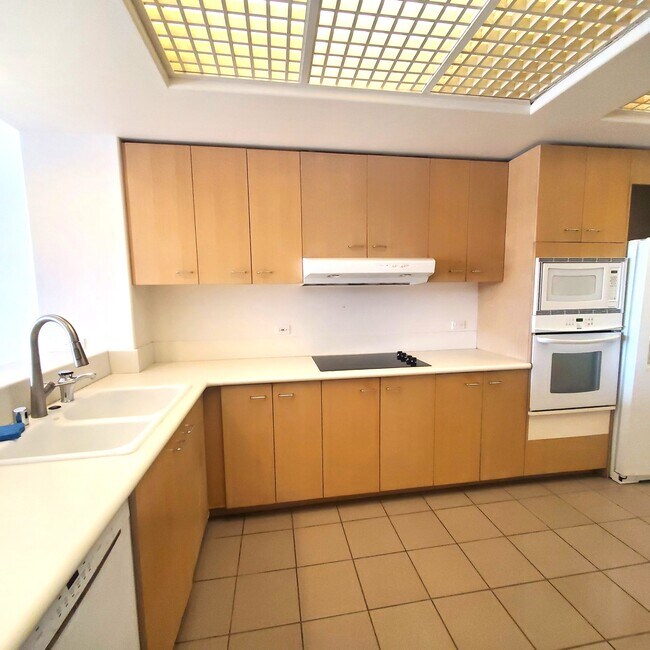 Kitchen corian countertops, built-in glass stove top - 1 Keahole Pl