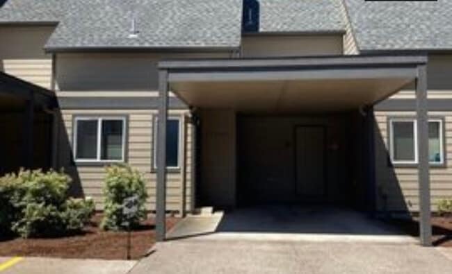 Covered car port and front entrance / storage unit end of car port - 1253 SW Maple Tree Ct