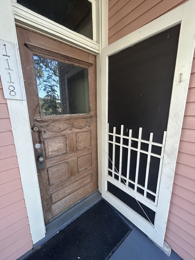 Front door with screen door. - 1118 25th St