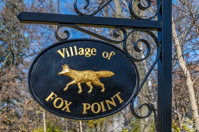 The Village of Fox Point sign highlights the community’s longtime woodland character.