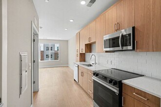 Elevate your lifestyle at Trail House Apartments, where modern design meets convenience. Enjoy sleek appliances and elegant finishes in a spacious kitchen perfect for culinary adventures. Explore your new home today! - Trail House Apartments
