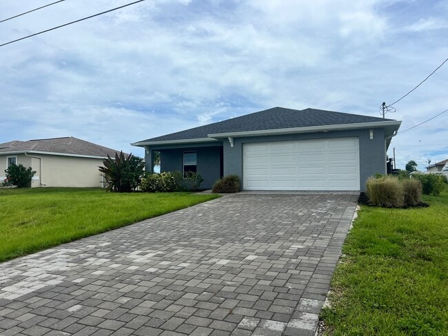 Building Photo - $500 off SPECIAL * Cape Coral 3BR/2BA Home with 2-Car Garage and Screened Lanai