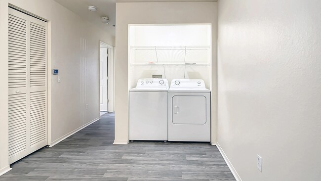 Enjoy the ease of laundry day with a full-size washer and dryer featured in every apartment. - Charleston Cay