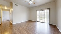 Located at 1900 Aquarena Springs Dr in San Marcos, TX, this single-story, 3-bedroom, 1-bathroom home offers a functional and comfortable layout across a well-utilized floor plan. The open-concept living area features warm wood-look flooring, crown molding, and a ceiling fan, creating a bright and airy atmosphere. The kitchen is equipped with dark espresso cabinetry, stainless steel appliances including a gas range, microwave, refrigerator, and dishwasher, along with a classic subway tile backsplash and a peninsula counter that connects seamlessly to the dining and living areas. Three bedrooms provide comfortable accommodations, with the primary bedroom offering a generous footprint. The bedrooms feature plush carpeting and ample closet space, with four closets distributed throughout the home. A dedicated laundry area with washer/dryer hookups adds everyday convenience. The single full bathroom serves the household efficiently. A private patio extends the living space outdoors, overlooking a serene open green landscape dotted with mature trees — ideal for relaxing or enjoying the Texas scenery. The home also includes a separate dining area and additional storage throughout.