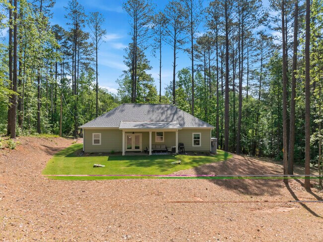 Back yard with covered patio/furniture and grill - 183 Crooked Creek Bay Rd
