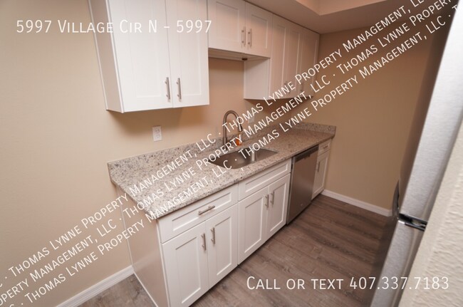 Building Photo - 5997 Village Cir N