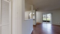 This 820 square foot single-story residence in Oviedo, FL offers a practical and comfortable living space. The home features two bedrooms, including a primary bedroom of 180 square feet, and two full bathrooms. The kitchen has been updated with modern stainless steel appliances, light wood cabinetry, and a stylish backsplash, creating an inviting cooking environment. 

The living areas boast a mix of plush carpeting and sleek hardwood flooring, adding warmth and character to the space. Large windows in the bedrooms allow for ample natural light, while ceiling fans provide added comfort and air circulation. The bathrooms are equipped with standard fixtures and tiled flooring for easy maintenance.

A notable feature is the in-unit laundry room, offering convenience for residents. The bedrooms are fitted with spacious closets, providing abundant storage options. The neutral color palette throughout the home creates a blank canvas for personal decorating styles.

Overall, this property presents a well-designed layout that maximizes the use of its 820 square feet, offering a balanced blend of functionality and comfort in a desirable Oviedo location.