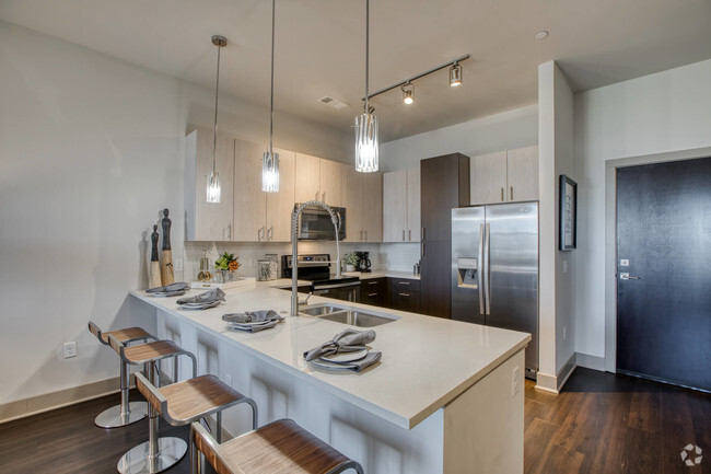 Chef-inspired kitchens feature stainless steel appliances - Centric LoHi by Windsor