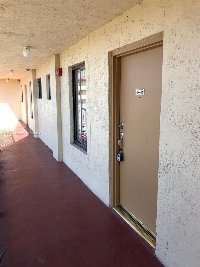 Building Photo - 9917 W Okeechobee Rd
