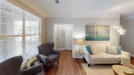 Located at 3301 Cotton Mill Dr in Raleigh, NC, this single-floor residence offers a well-designed layout with thoughtful finishes throughout. The living area welcomes you with rich hardwood flooring, crown molding, and generous natural light streaming through large windows with blinds, creating a warm and inviting atmosphere.

The kitchen is outfitted with crisp white cabinetry, granite countertops, a grey subway tile backsplash, stainless steel appliances, and a dishwasher — combining both style and functionality in an efficient galley-style layout.

The primary bedroom is a standout feature, boasting a tray ceiling with crown molding detail, plush carpeting, and French doors that open to outdoor views, along with access to a walk-in closet. A second bedroom offers carpeted flooring and a bright window with ample natural light.

Two bathrooms serve the residence: one features a tub/shower combination with tiled surround, a white vanity, and hardwood flooring; the other offers a clean, modern vanity with a large mirror and stylish lighting fixtures.

The overall ambiance is neutral and polished, with a consistent palette of soft greys and whites that lend a contemporary yet comfortable feel throughout the home.