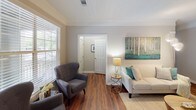 Located at 3301 Cotton Mill Dr in Raleigh, NC, this single-floor residence offers a well-designed layout with thoughtful finishes throughout. The living area welcomes you with rich hardwood flooring, crown molding, and generous natural light streaming through large windows with blinds, creating a warm and inviting atmosphere.

The kitchen is outfitted with crisp white cabinetry, granite countertops, a grey subway tile backsplash, stainless steel appliances, and a dishwasher — combining both style and functionality in an efficient galley-style layout.

The primary bedroom is a standout feature, boasting a tray ceiling with crown molding detail, plush carpeting, and French doors that open to outdoor views, along with access to a walk-in closet. A second bedroom offers carpeted flooring and a bright window with ample natural light.

Two bathrooms serve the residence: one features a tub/shower combination with tiled surround, a white vanity, and hardwood flooring; the other offers a clean, modern vanity with a large mirror and stylish lighting fixtures.

The overall ambiance is neutral and polished, with a consistent palette of soft greys and whites that lend a contemporary yet comfortable feel throughout the home.