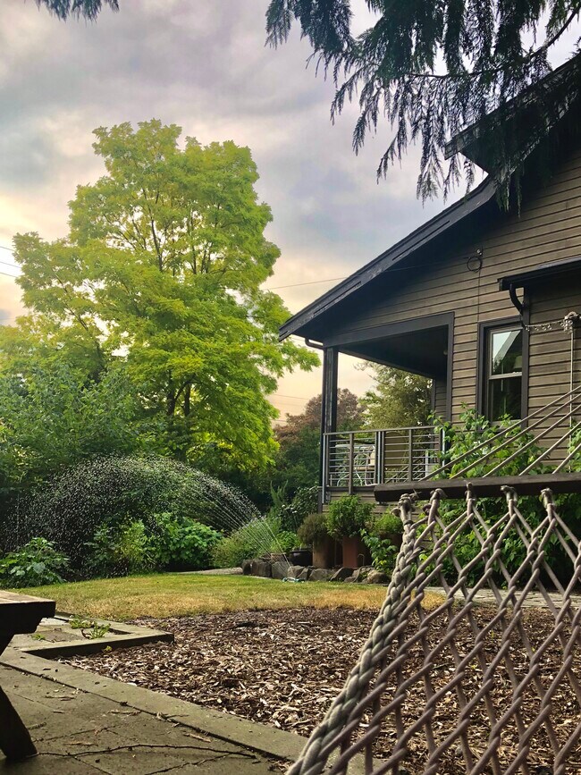 From hammock patio looking toward front porch - 9022 Evanston Ave N