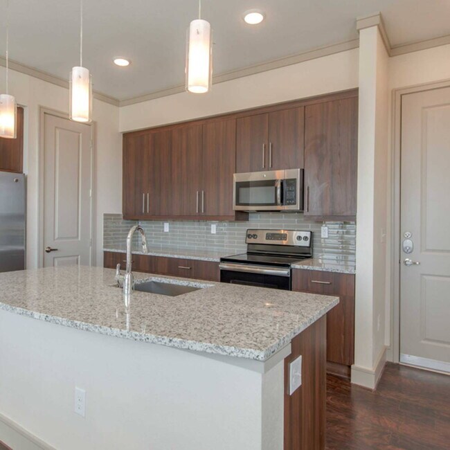Building Photo - Experience the Art of Fine Apartment Living!