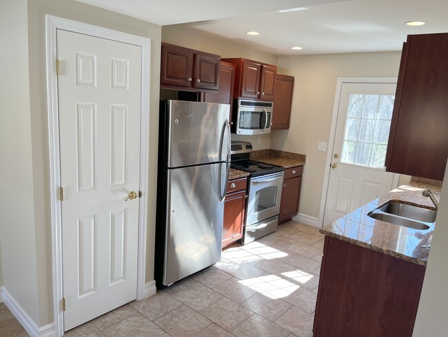 kitchen with granite counters and pantry - 27 Eddie Dr
