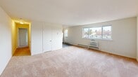 Located at 785 Cherry Tree Rd in Upper Chichester, PA, this one-bedroom, one-bathroom unit offers a practical and functional single-floor layout. The combined living and dining area serves as the heart of the home, featuring soft wall-to-wall carpeting, neutral light-toned walls, and large windows that invite generous natural light while offering views of the surrounding neighborhood. Baseboard heating and a wall-mounted A/C unit provide year-round climate control. The front entry opens directly into this open living space, creating a welcoming and unobstructed flow. The kitchen is efficiently arranged and connects seamlessly to the main living area. A hallway leads to the spacious primary bedroom, which is carpeted and bright, benefiting from its own window with an outdoor view and baseboard heating. A wide double bi-fold closet provides substantial storage. Two closets throughout the unit add further organizational convenience. The full bathroom features wood-look vinyl flooring, a white vanity with sink, a mirrored medicine cabinet, and a shower/tub combination. A utility room rounds out the layout, adding practical functionality. The overall design is clean, bright, and efficient, making thoughtful use of every square foot.
