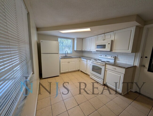 Building Photo - True 3 Bed~2 Bath~with garage. Over 1,000 sq ft, with updated kitchen & bathrooms, large open liv...