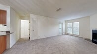 This 640 square foot apartment in Madison, Tennessee offers a thoughtful layout maximizing space and functionality. The single-floor design features one bedroom measuring 160 square feet, providing ample space for rest and relaxation. The open-concept living area seamlessly integrates the kitchen and living room, creating a spacious feel.

The kitchen boasts modern amenities with wooden cabinets, black appliances, and a convenient breakfast bar. The adjacent living room is highlighted by a fireplace, adding warmth and character to the space. Large windows throughout allow natural light to flood the apartment, enhancing its bright and airy atmosphere.

The bathroom is efficiently designed with a combination tub-shower, modern fixtures, and wooden vanity. Two closets offer generous storage options. Plush carpeting in the living areas and bedroom adds comfort underfoot, while the kitchen and bathroom feature durable wood-look flooring.

Ceiling fans in the bedroom and living area provide air circulation and additional comfort. The neutral color palette throughout allows for easy personalization. This well-appointed apartment is ideal for singles or couples seeking a modern, low-maintenance living space in a convenient Nashville suburb.
